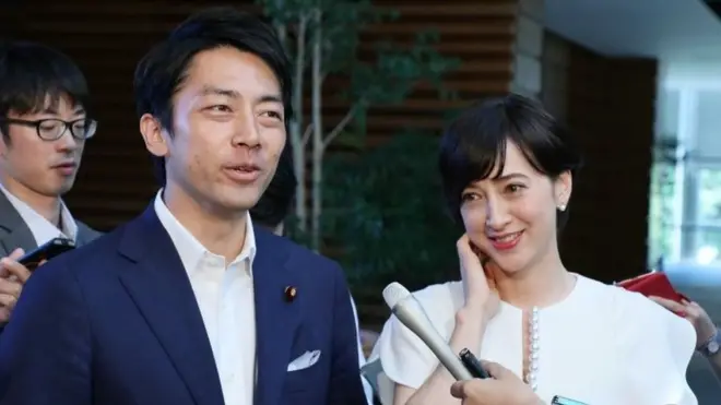 Shinjiro Koizumi (left) is married to Christel Takigawa (right), a French-Japanese news presenter