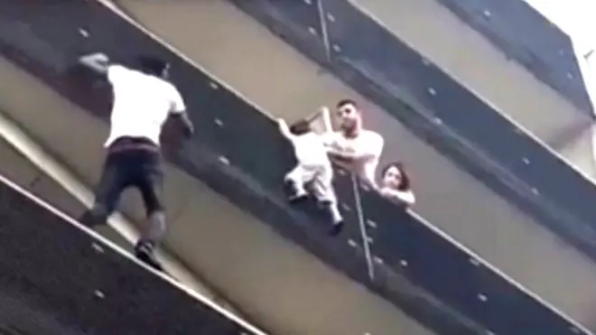 Mamoudou Gassama scales building to rescue child. 27 May 2018