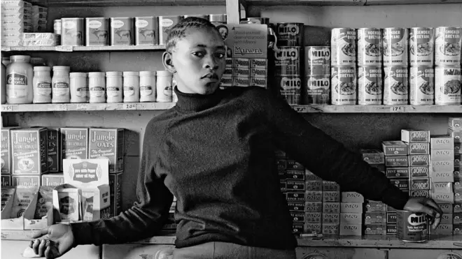 One of Goldblatt's best-known works is this photo taken in 1977, entitled, 'Shop assistant, Orlando West, Soweto, Johannesburg'.
