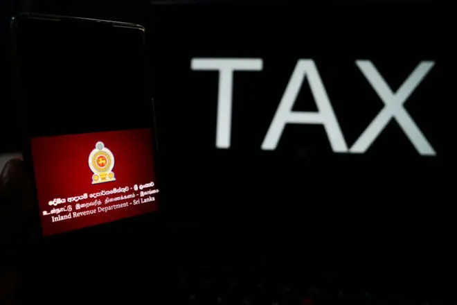 ඔබේ බැංකු තැන්පතුවලින් අය කෙරෙන රැඳවුම් බද්දට ආණ්ඩුව කරන්න යන්නේ කුමක් ද?