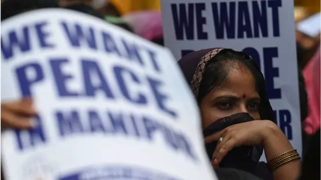 Members of the All India Mahila (AIMC) Congress hold placards during a protest over sexual violence against women and for peace in the ongoing ethnic violence in India's north-eastern state of Manipur, in Delhi on 20 July, 2023