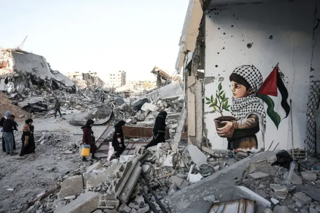 صورة رسمها فنان فلسطيني بعد عودته إلى منزله مع وقف إطلاق النار.
رفح، غزة، في 20 يناير/كانون الثاني 2025