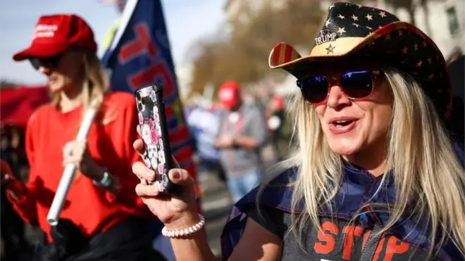 Gathering demonstrators cheered as a motorcade carrying President Trump passed as it left the White House on Saturday