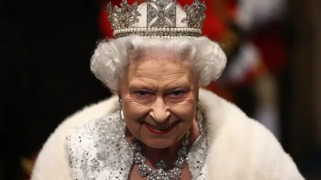The Queen arrives for the State Opening of Parliament in 2013
