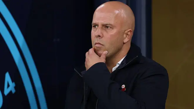 Arne Slot appears deep in thought during Liverpool's 3-0 loss at Manchester City