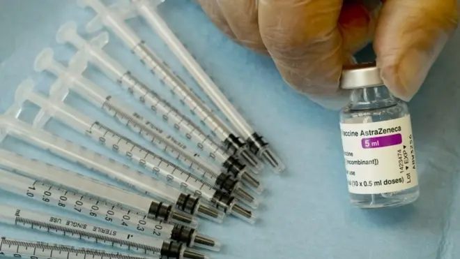 A health worker prepares to administer a dose of AstraZeneca COVID-19 vaccine