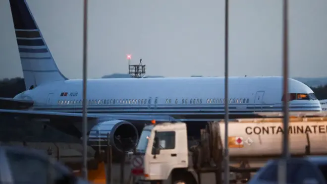 The first plane to fly refugees to Rwanda from Britain, which was eventually stopped, sits on the tarmac at MOD Boscombe Down base, Wiltshire, in June