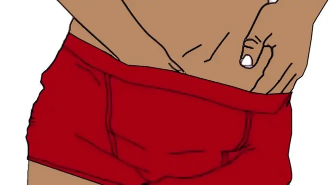 Aworan ọkunrin to n fi ọwọ kan nkan ọmọkunrin rẹ