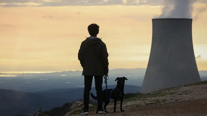 A boy with his dog visits 'Delle Biancane' park of the geothermal power plant of Monterotondo Marittimo in Tuscany on February 13, 2022 in Monterotondo Marittimo - Grosseto, Italy.
