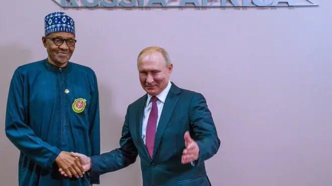 Nigeria President and Russia President Vladimir Putin dey shake hand for dia tok-tok for Sochi