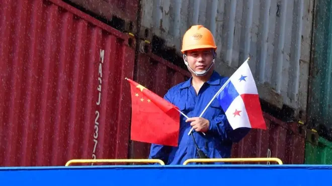 Crew members of Chinese Cosco Shipping Rose container ship stand on deck, upon arrival at the newly inaugurated Cocoli locks during the visit of China"s President Xi Jinping, in the Panama Canal, on December 3, 2018, - Chinese President Xi Jinping is on an official visit to Panama after attending the G20 Summit in Argentina. (Photo by Luis Acosta / AFP)LUIS ACOSTA/AFP/Getty Images