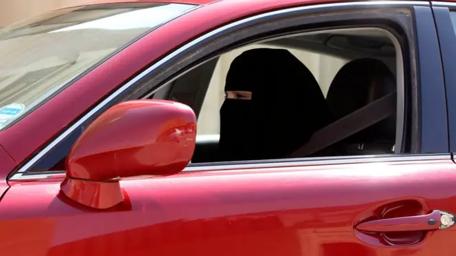 A woman drives a car in Riyadh, Saudi Arabia on 22 October 2013