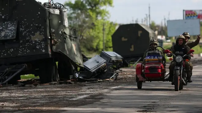 A road which connects Kharkiv and a village recently retaken