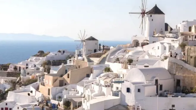 Traditional Windmill at Oia village on July 16 2018 in Santorini, Greece