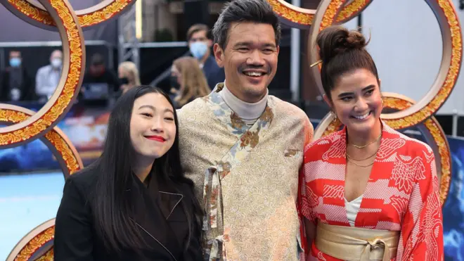 Awkwafina, Destin Daniel Cretton and sister Joy Cretton arriving for the UK premiere of Marvel Studio"s Shang-Chi at Curzon Mayfair, central London. Picture date: Thursday August 26, 2021.