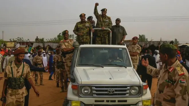 General Abdel Fattah al-Burhan, the head of Sudan"s ruling military council, greeting supporters in Omdurman on 29 June