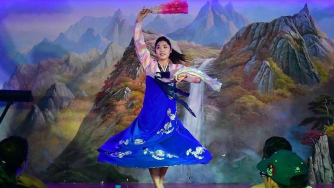 A traditional dancer performs for patrons at the Pyongyang Okryu-gwan, a North Korean restaurant in Dubai, 21 September 2017