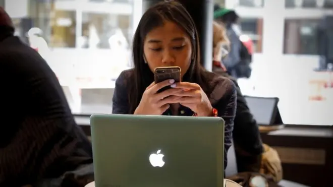 Woman using Apple Mac