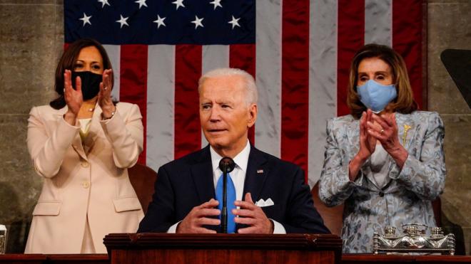 Joe Biden speaking to Congress in front of Kamala Harris and Nancy Pelosi