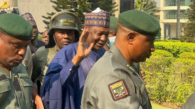 File photo of Malami accompanied by security operatives