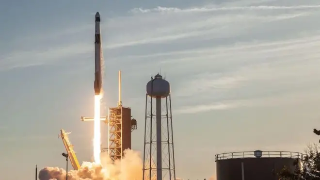 A rocket launches from Earth