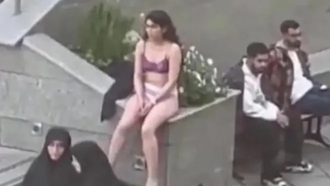 Screengrab of a video showing an Iranian woman sitting in her underwear at the Science and Research Branch of Islamic Azad University in Tehran, Iran