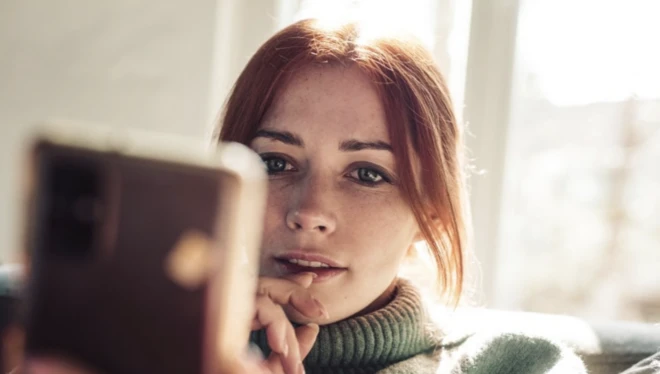 Woman using smartphone (stock image)