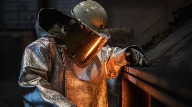 A worker at a steel factory in Germany