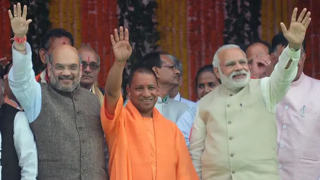 નરેન્દ્ર મોદી, અમિત શાહ અને યોદી આદિત્યનાથનો ફોટો