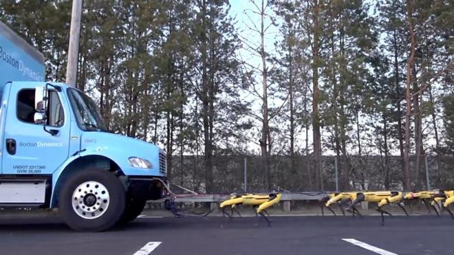 Роботы Boston Dynamics тащат грузовик