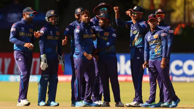 Wanindu Hasaranga of Sri Lanka celebrates with teammates after dismissing Christopher McBride (not pictured) of Scotland during the ICC Men's Cricket World Cup Qualifier Zimbabwe 2023 match between the Sri Lanka and Scotland at Queen’s Sports Club on June 27, 2023 in Bulawayo, Zimbabwe