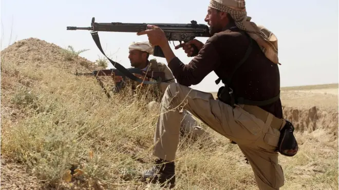 Iraqi soldiers guard a position on the front line against Islamic State (IS) group jihadists near Fallujah, in Iraq"s Anbar province, on May 3, 2016