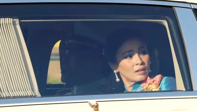 Thailand"s King Maha Vajiralongkorn and Queen Suthida are pictured as the motorcade drives towards the Grand Palace in Bangkok, Thailand October 14, 2020.