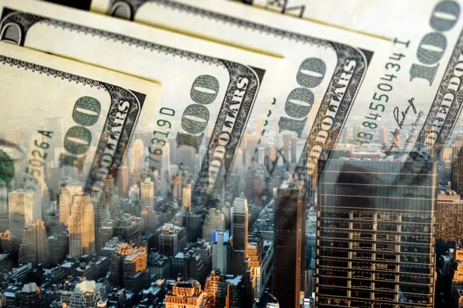 Skyline of NYC - Panoramic view of New York City and cash dollar bills
