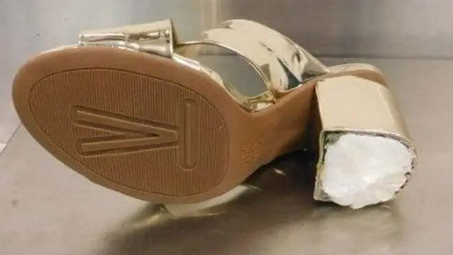 Cocaine was found inside the heel of Woodrum's shoes