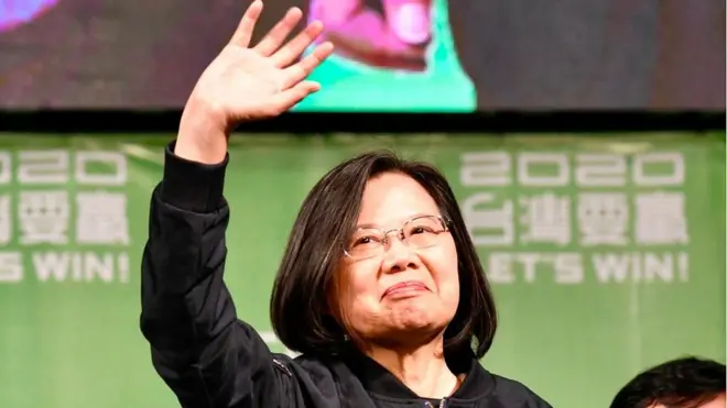 Taiwan's President Tsai Ing-wen waves to supporters outside her campaign headquarters in Taipei on January 11, 2020
