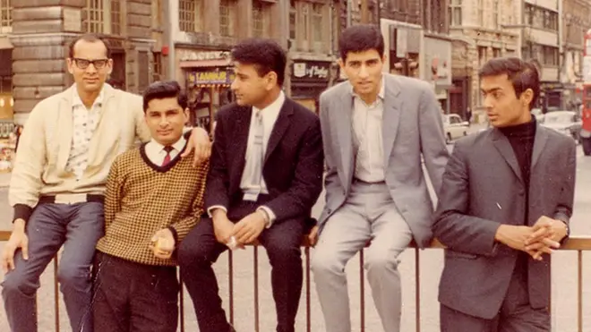 Praful's YMCA friends sitting on the railings at Piccadilly Circus