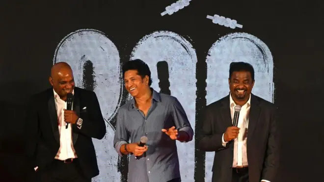 Former cricket player Sachin Tendulkar (C) of India speaks as Muttiah Muralitharan (R) and Sanath Jayasuriya of Sri Lanka watch during the trailer launch ceremony of '800', the biopic of Muralitharan, in Mumbai on September 5, 2023