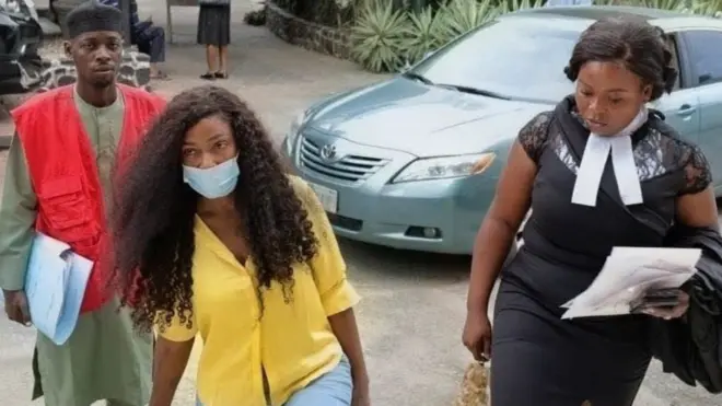 Nigeria social media Blessing CEO wear yellow shirt and she cover face mask