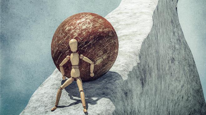 Manequim subindo uma colina íngremeaplicativo de jogo blazecostas levando uma bolaaplicativo de jogo blazemetal pesada simbolizando esforço