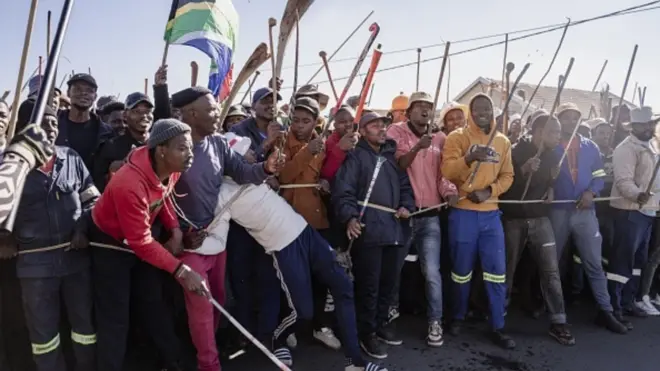 Various groups protest during one march against illegal immigrants on June 30, 2026 for Pretoria, South Africa. 