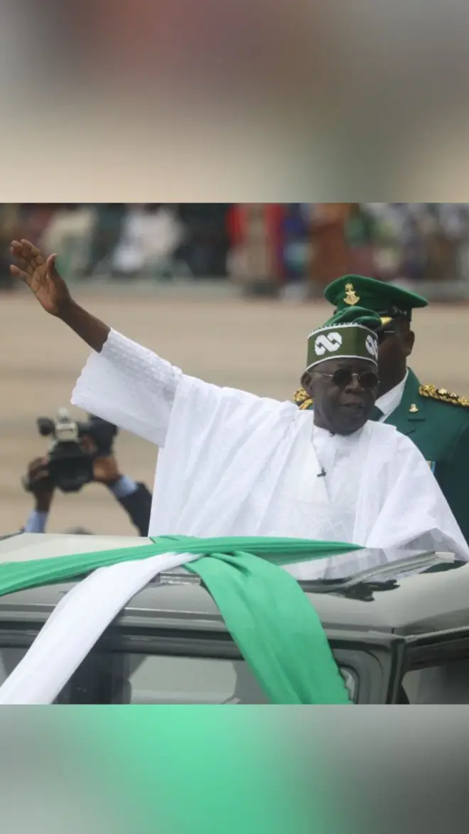 President Bola Tinubu waving