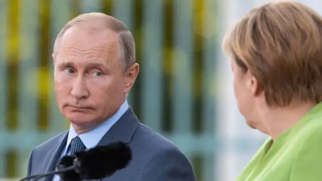 بوتين وميركل