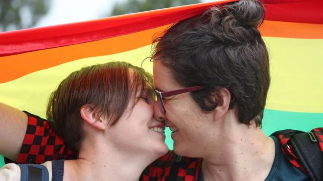 A gay couple celebrates the vote in Melbourne