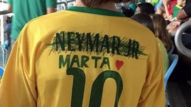Screengrab of a tweet by Danielle Warby showing a boy wearing a Neymar replica jersey with the name crossed out and that of Marta drawn on