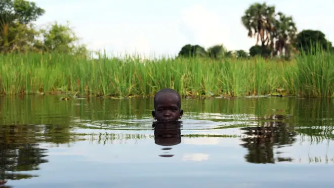 A displaced girl plays in the Sudd Swamp near the town of Nyal, South Sudan - Sunday 19 August 2018
