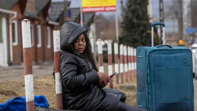 African woman sitdon for floor after she run away sake of Russia-Ukraine war