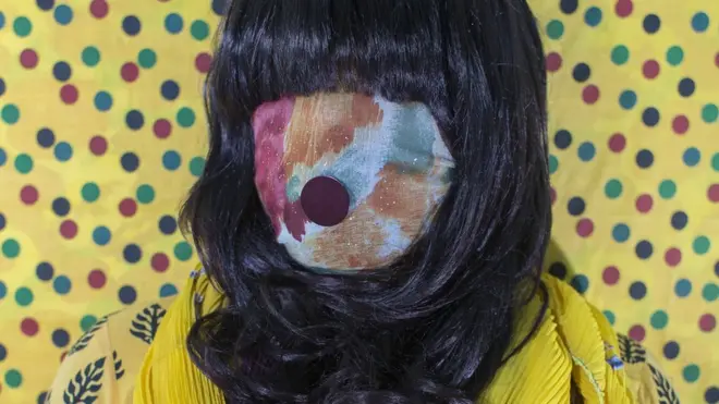 Bangladeshi woman with face covered by fabric