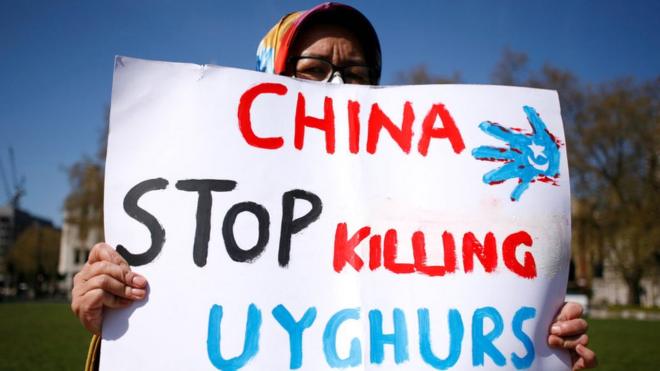 Members of the Uyghur community at a protest in London.