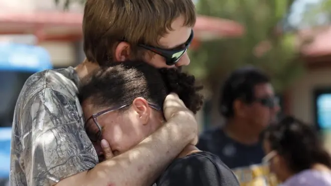 Kianna Long, right, was in the freezer section of the Walmart during the shooting